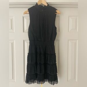 Black sleeveless cocktail dress with silver sheen.  Size M.